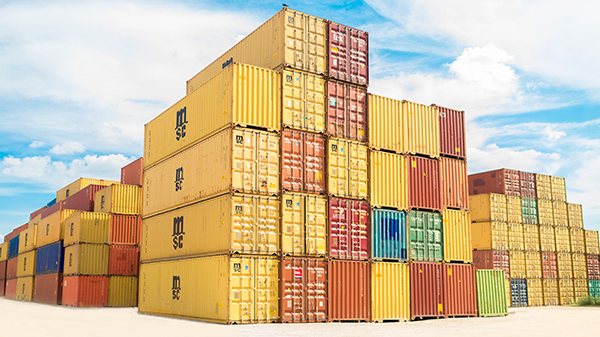 A stack of cargo containers on the ground.