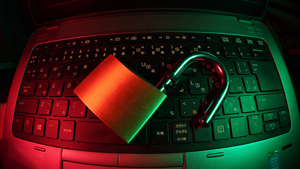 A computer keyboard with a padlock on it.