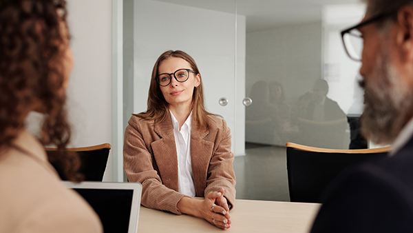 Three people in an interview.