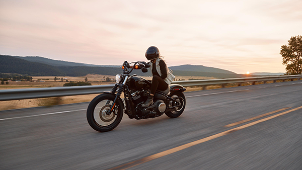 Motorcycle on the road at sunset