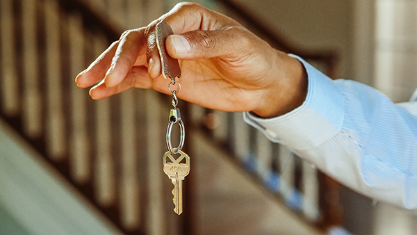 A hand holding a key