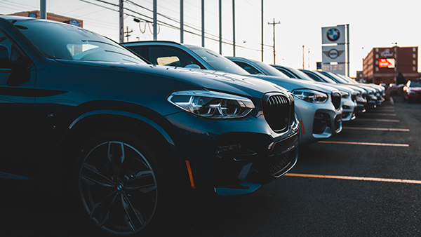 A parking lot with cars for sale.