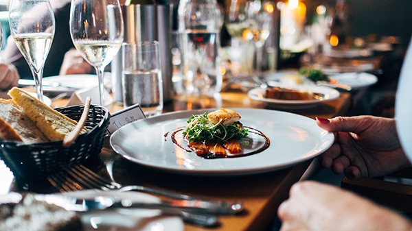 A restaurant table with fine dining settings