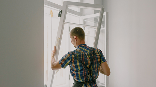 A window installer working on a window installation